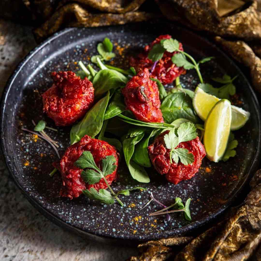 Chargrilled Indian-style prawns marinated in spices and served on a platter at Shakinah Indian restaurant in Malta
