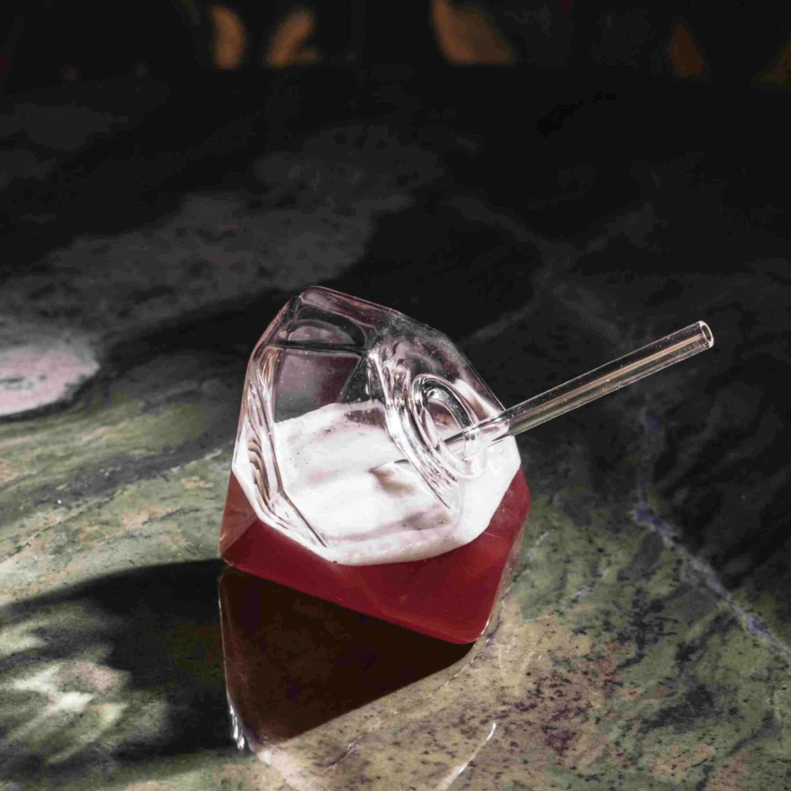 Ruby red cocktail in diamond-shaped glass at Ruby Rays cocktail bar in St. Julian’s, Malta